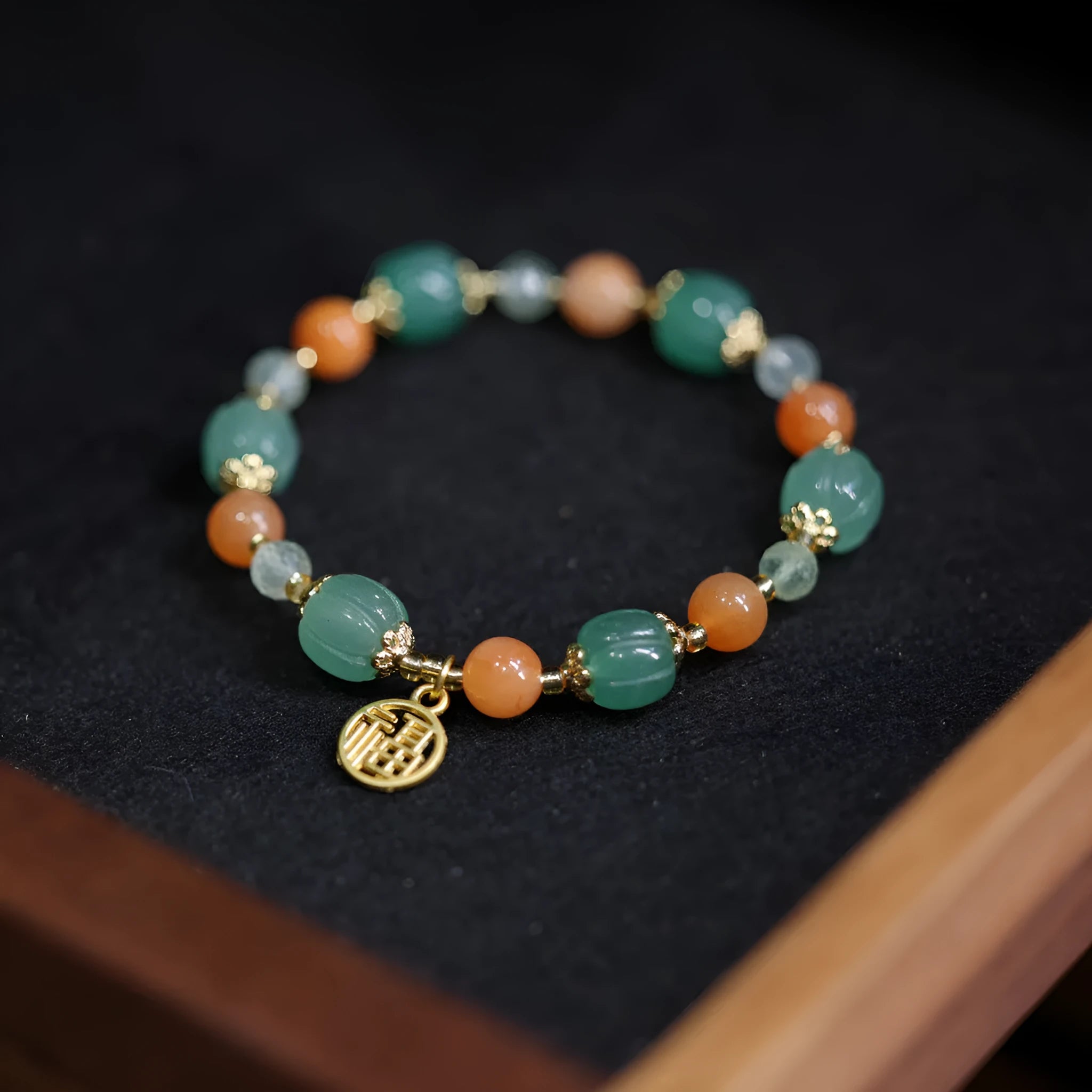 Jinsi Jade Duobao Pumpkin Bracelet with Prehnite stones for a 14-16.5cm wrist.