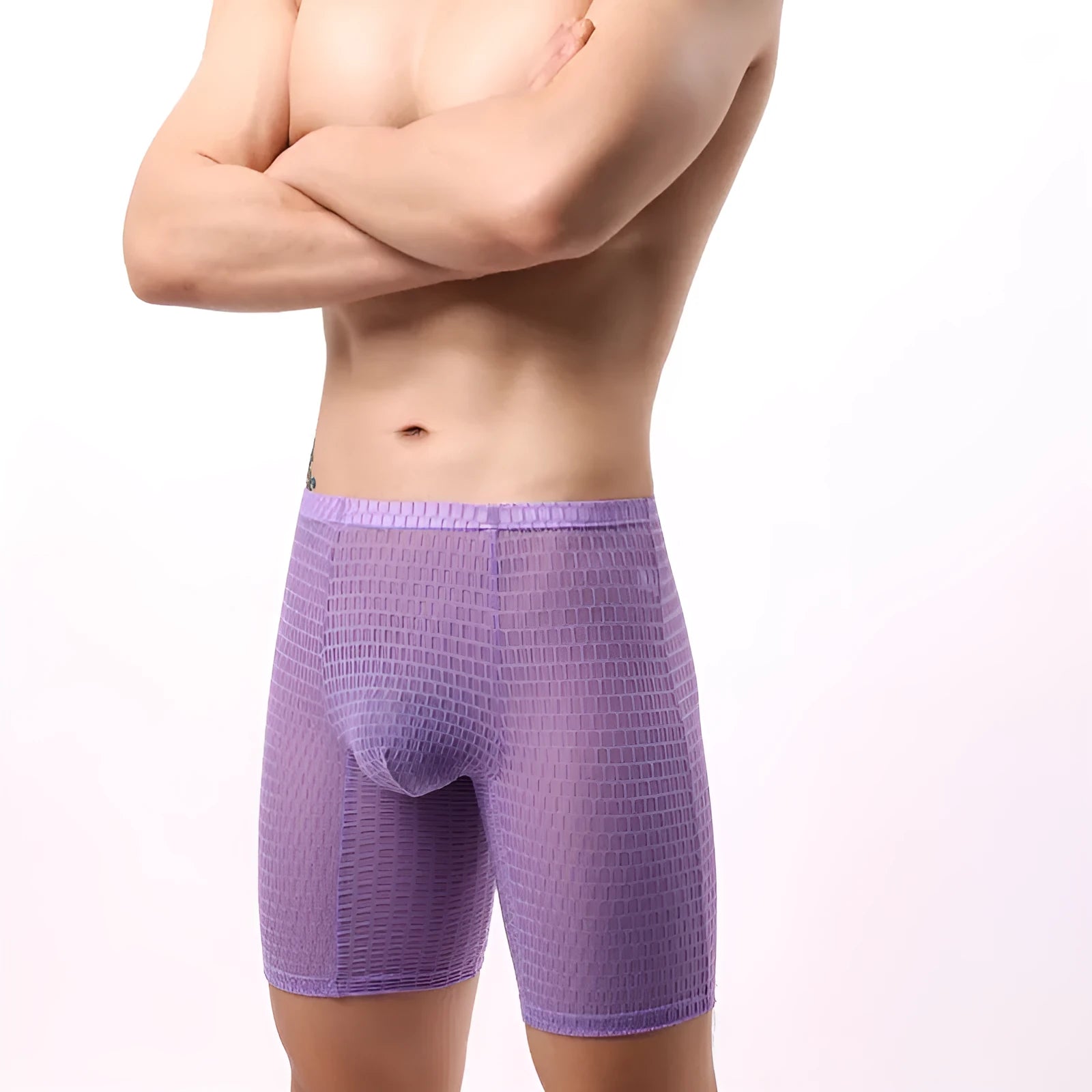 Men's white lace boxer shorts laid flat, showing mid-waist design and knitted fabric texture.