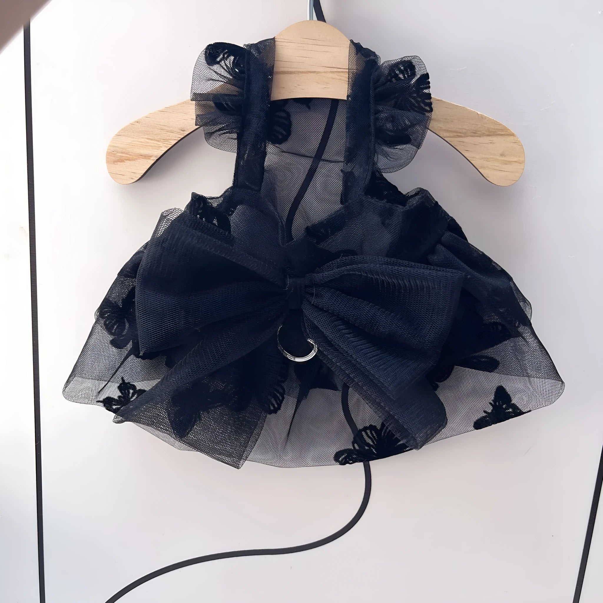 Black gauze tulle princess skirt costume on a small dog, showing the layered skirt and fitted bodice.
