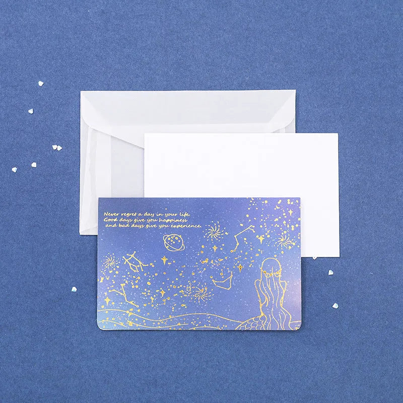 Three decorative paper envelopes with bronzing mermaid design in assorted colours