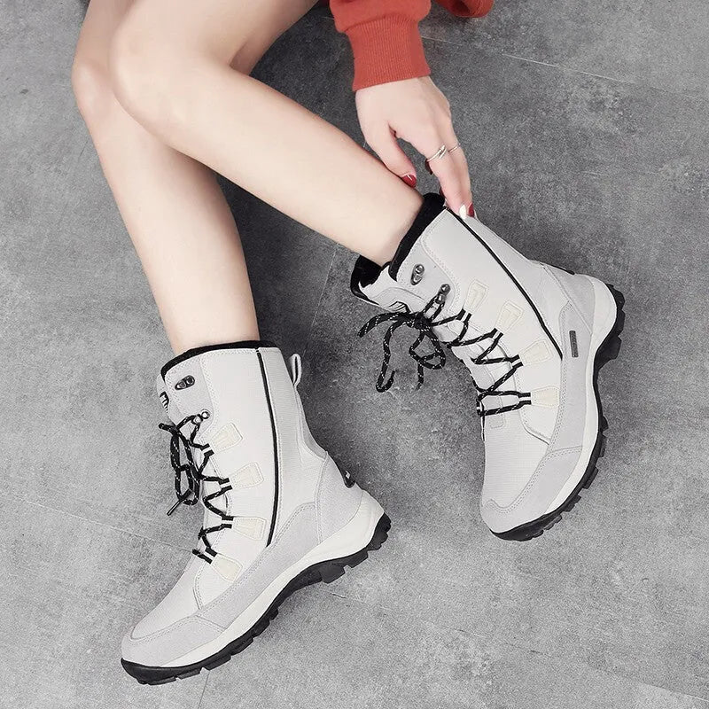 Women's black waterproof thermal snow boots with genuine leather uppers and rubber soles