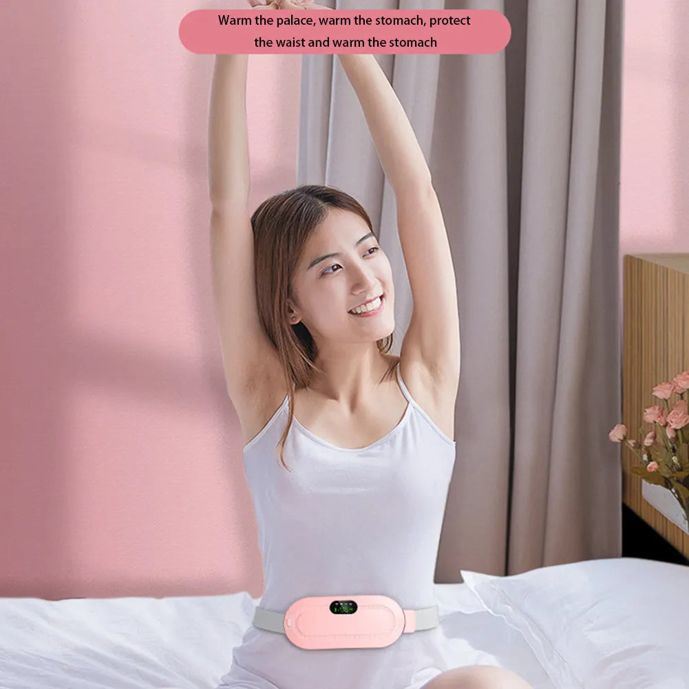 Pink electric menstrual heating pad with controller showing temperature display and vibration settings