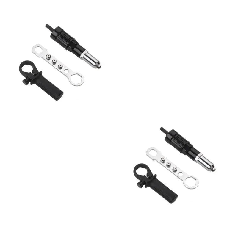 Black metal electric drill rivet gun with wrench and rivet heads on a workbench.