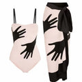 Women's patterned one-piece bikini with a matching lightweight tulle skirt.