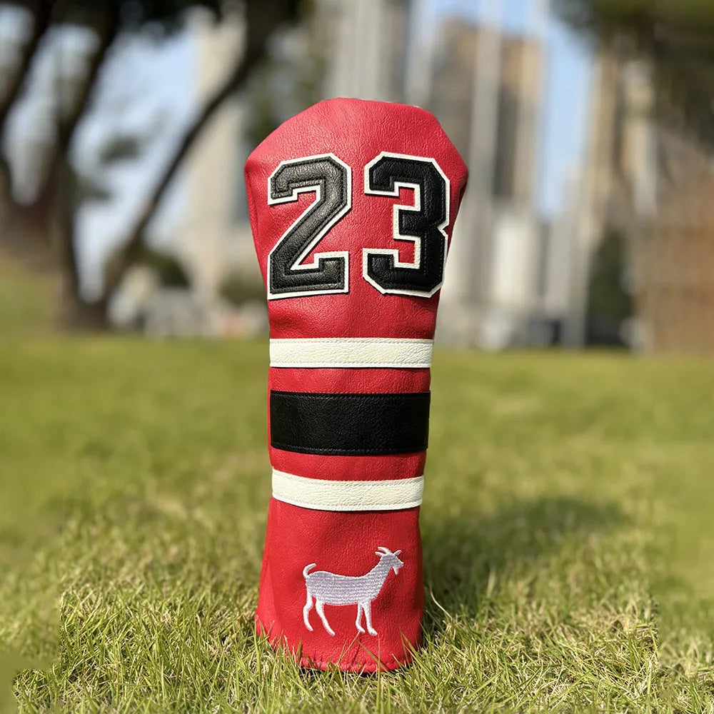 Set of coloured chicken drumstick design golf club head covers for fairway woods, a square putter, and irons.