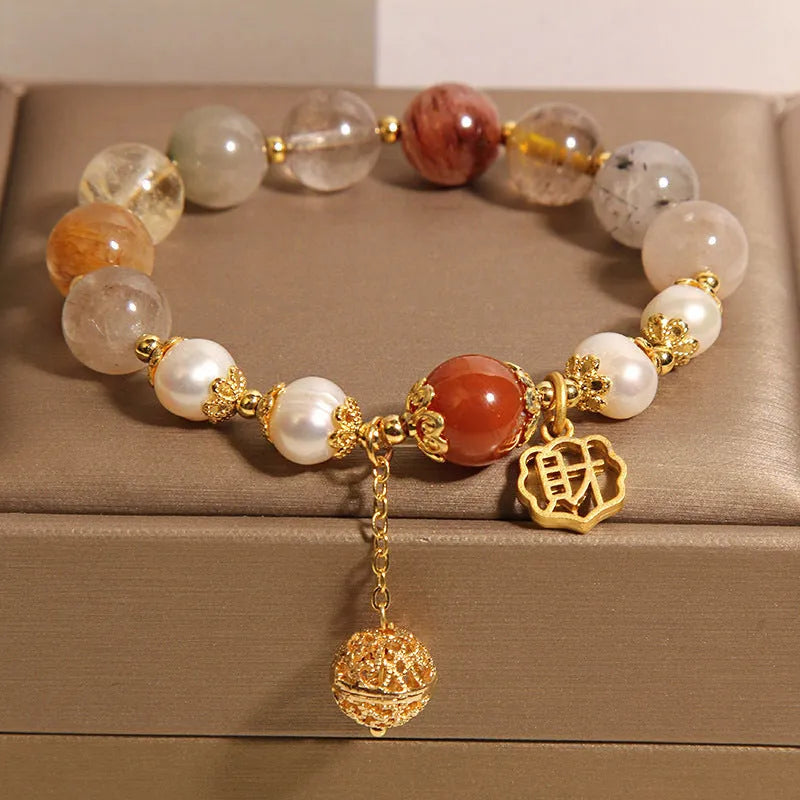 Women's adjustable crystal pearl bracelet with four pearls and Chinese Cai charm in natural hair colours
