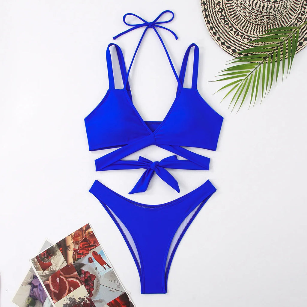 Women's solid colour strap bikini swimsuit in black, shown on a mannequin.