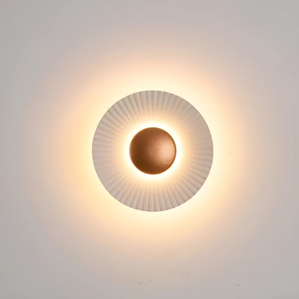 Round wall lamp with an aluminium shade and dimmable LED bulb in a white and gold colour finish.