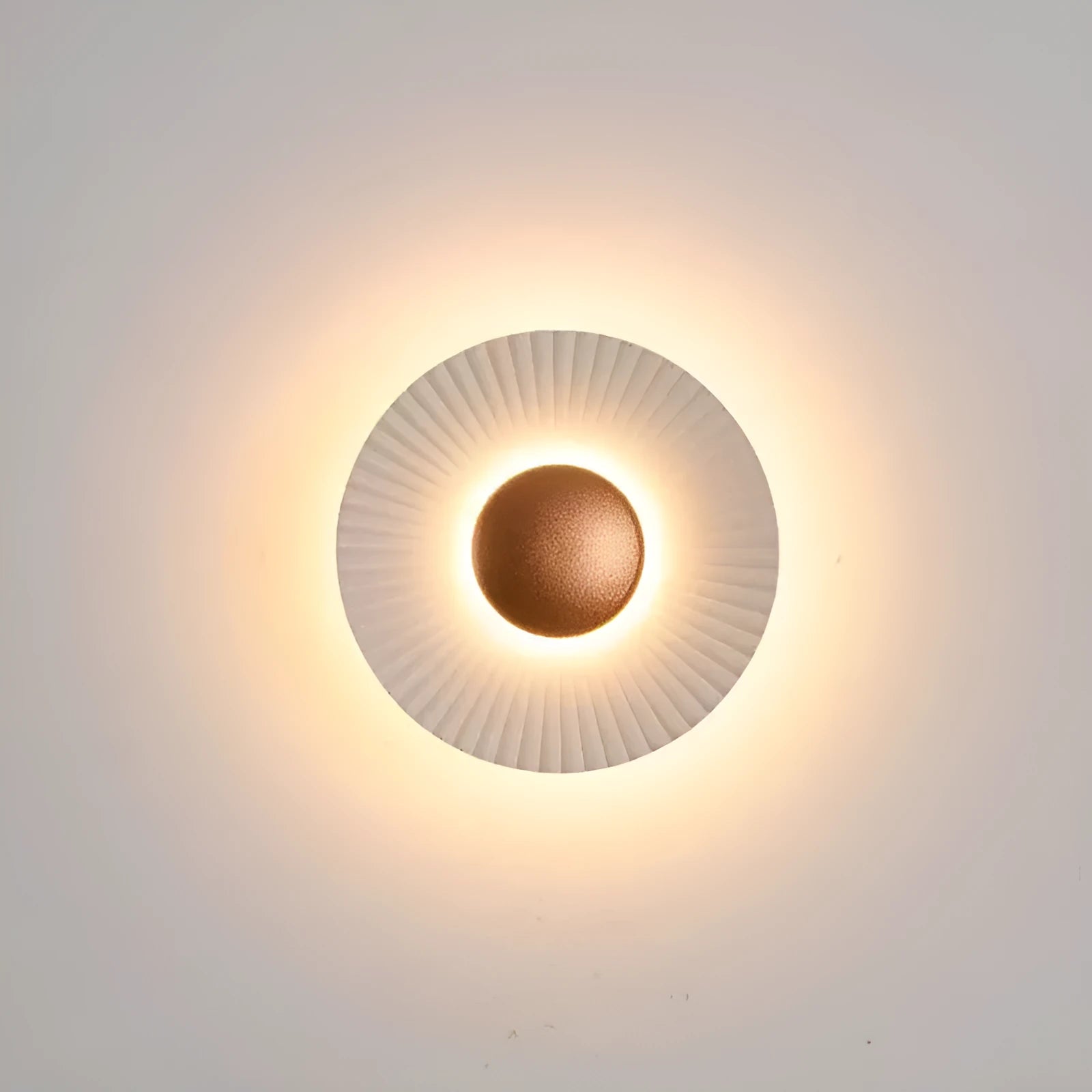 Round wall lamp with an aluminium shade and dimmable LED bulb in a white and gold colour finish.