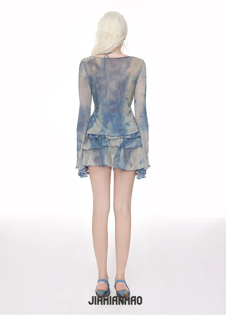 Women's blooming blue long-sleeved swim blouse with steel support and matching briefs on a hanger.