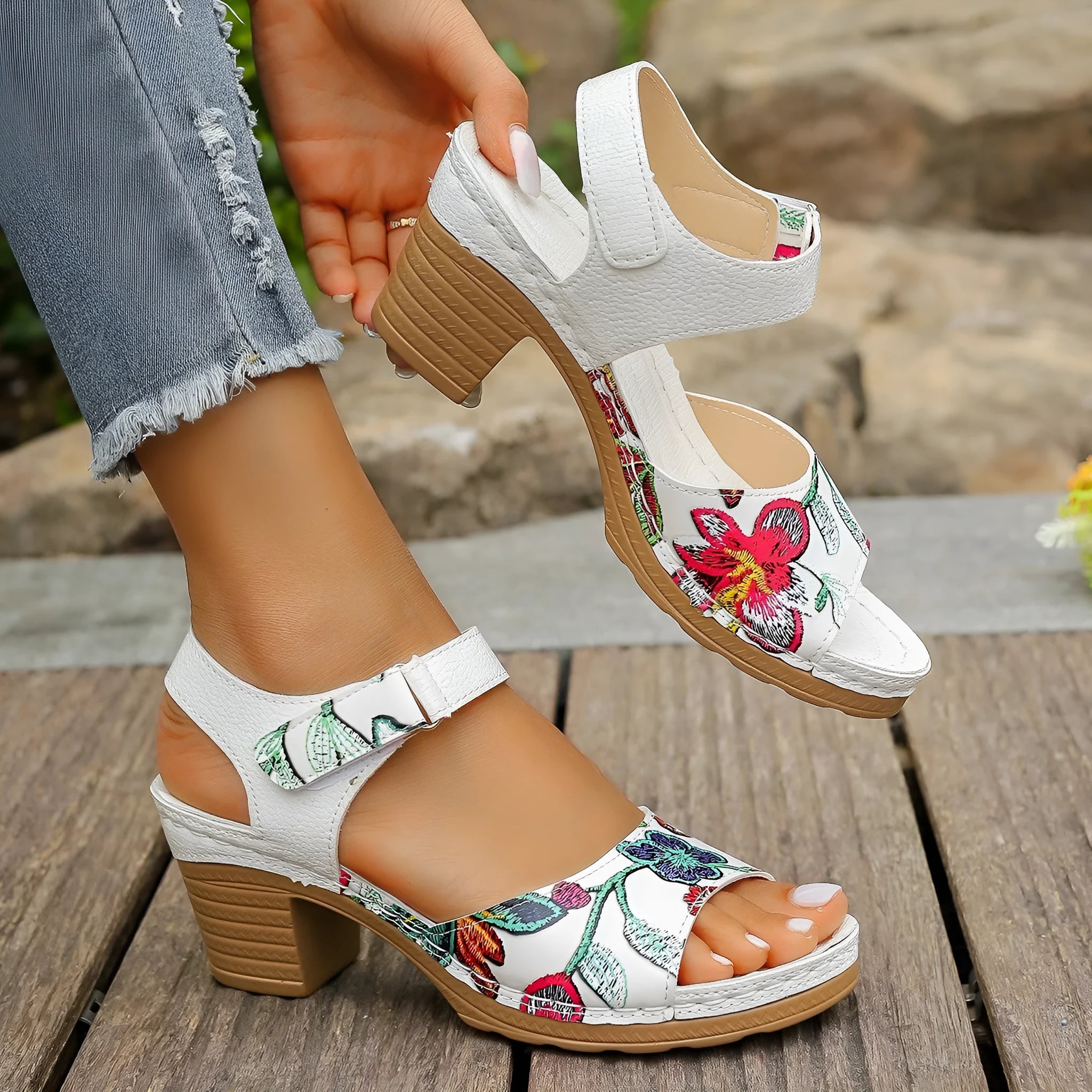 White women's high heel sandals with velcro buckle closure showing rubber sole