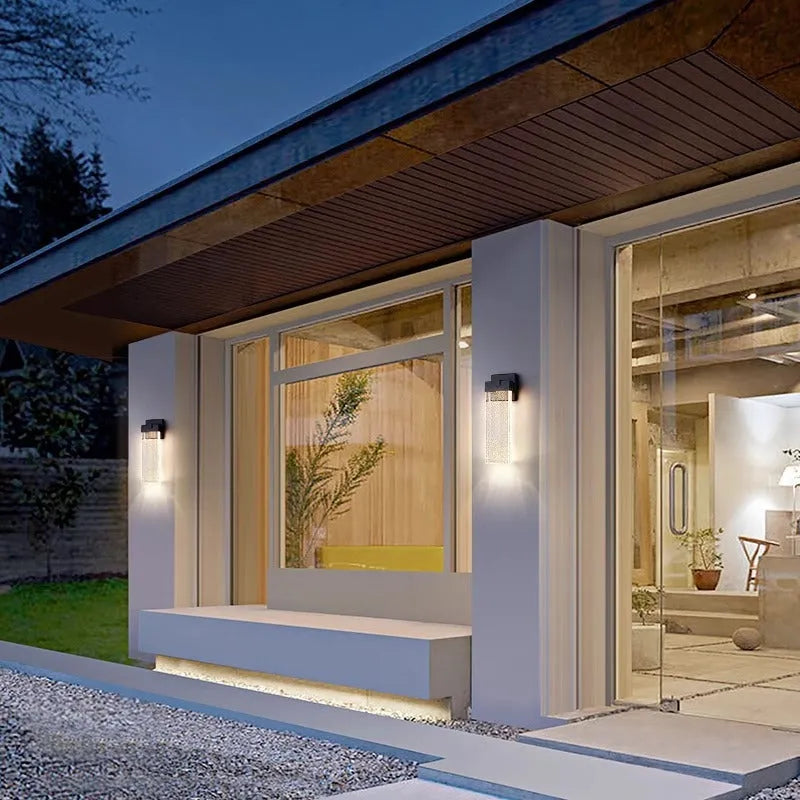 Black stainless steel outdoor LED wall lamp for courtyard or corridor mounting.