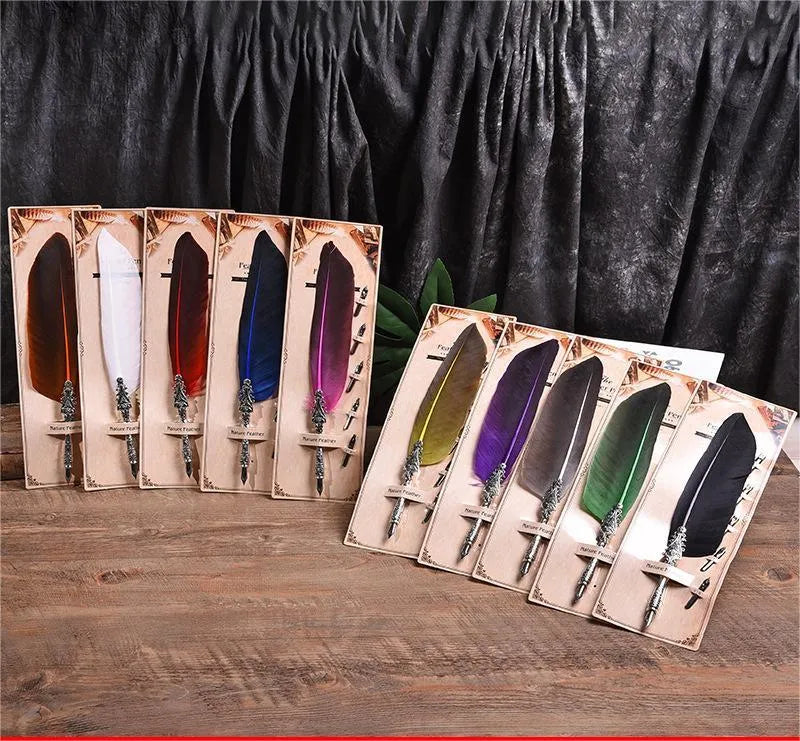 Retro zinc alloy feather dip pen in choice of ten colours on a desk.