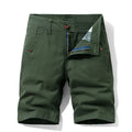 Man wearing khaki coloured pure cotton casual overalls with straight legs and a zip fly.