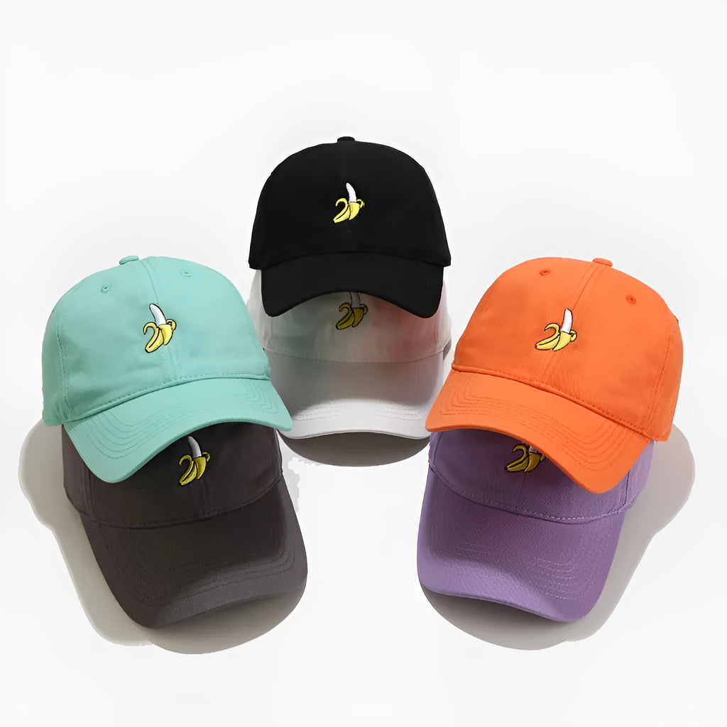 Adjustable baseball cap with cute banana embroidery in seven colour options on soft polyester fabric