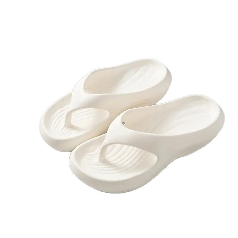 Women's thick-soled EVA flip-flops in black, white or grey with non-slip patterned soles