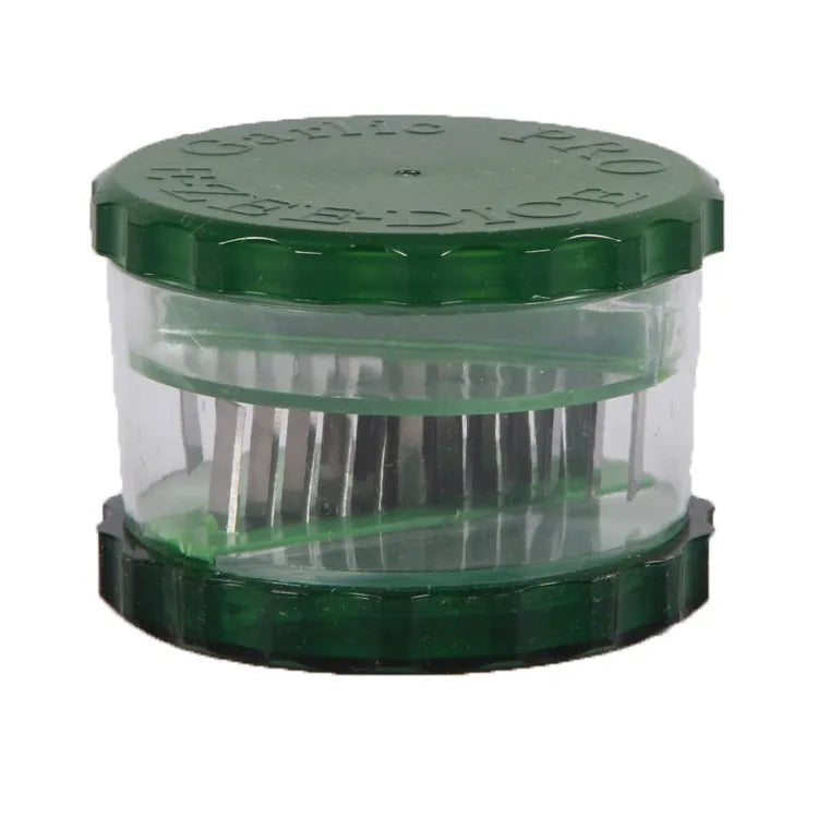 Green transparent PP plastic garlic peeler kitchen gadget on a countertop
