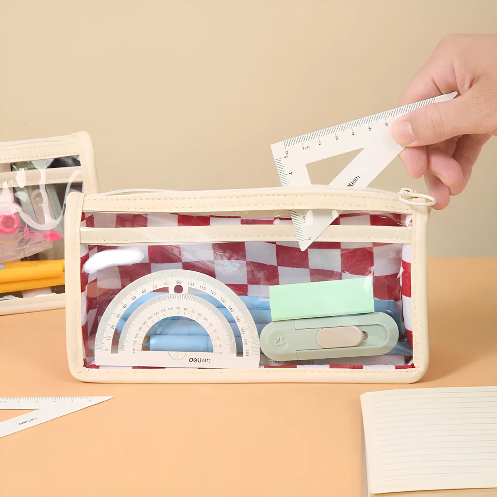 Transparent PVC pencil case with chessboard pattern, open to show large interior for pens.