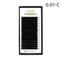 Close-up of dense 16-row matte mink hair false eyelashes on a clear band, showing natural finish.