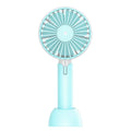 Blue mini handheld USB electric fan with three-speed control on desktop