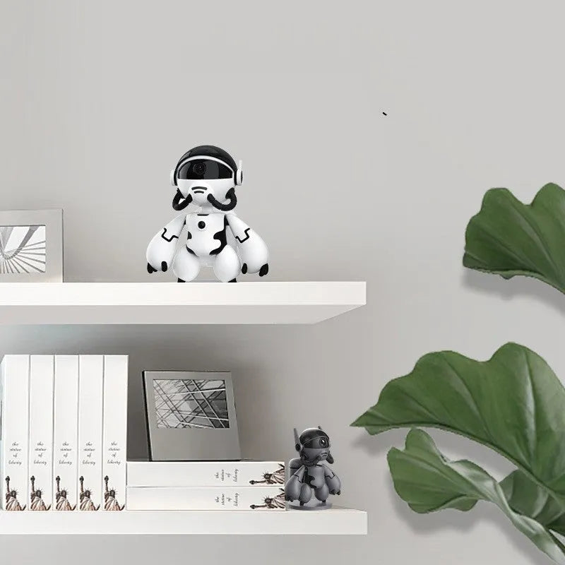 White Space Robot smart home security camera with detachable base on a table