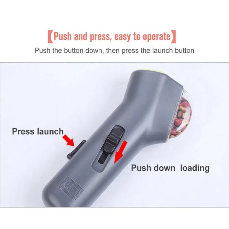 Grey dog training snack launcher catapult showing spring trigger mechanism and compact 18cm design