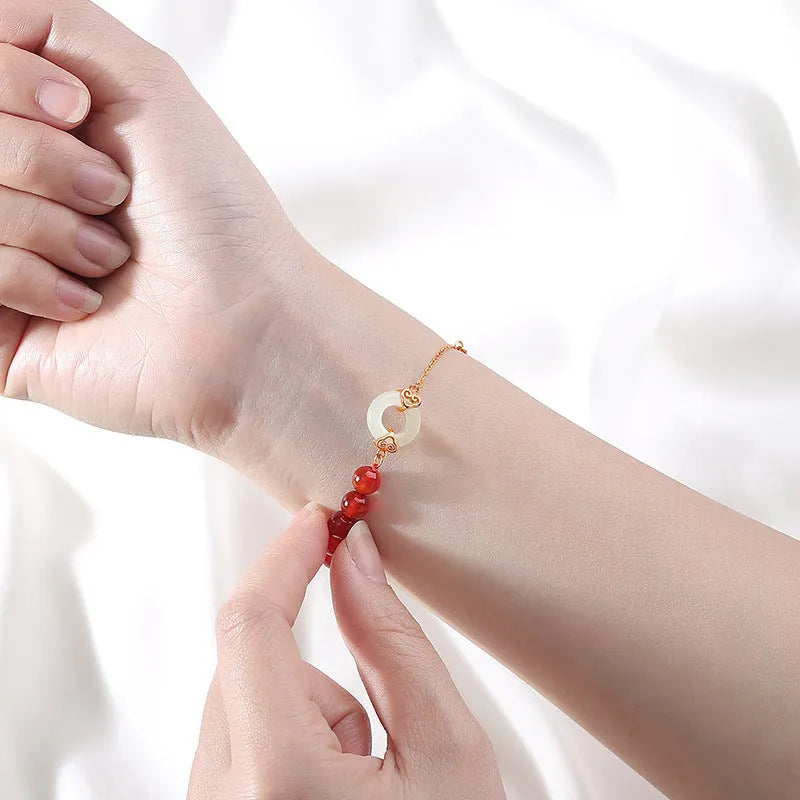 Sterling silver 925 bracelet with a peace buckle charm, xiangyun designs, and a fu character.