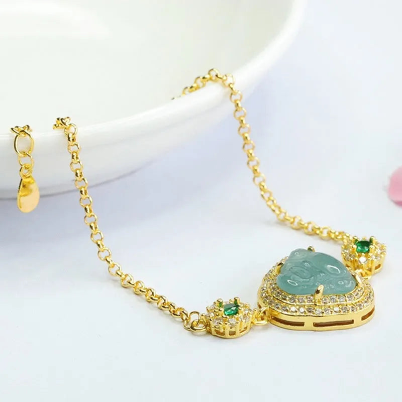 Emerald blue water jade bracelet with inlaid Maitreya Buddha charm measuring 10x13mm.