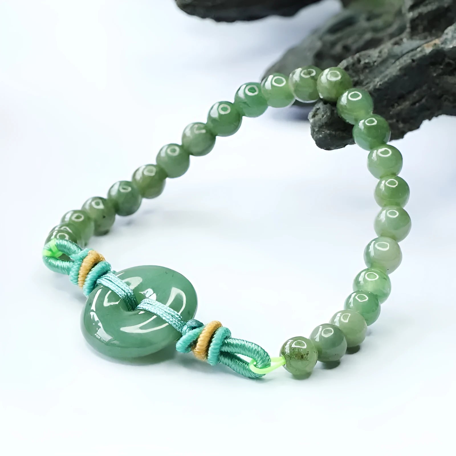 Emerald green jade bracelet with peace buckle clasp and star design elements