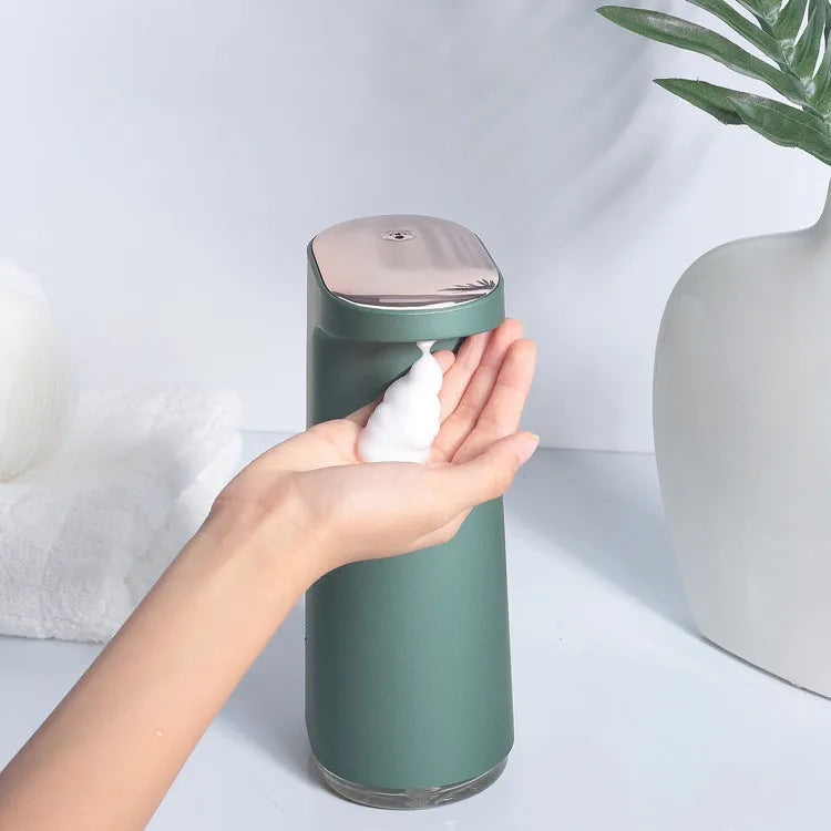 Automatic foam soap dispenser with infrared sensor in white colour on bathroom counter