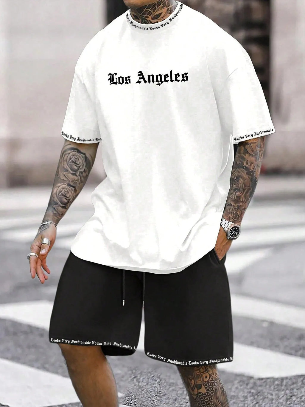 Men's blue printed short sleeve top and matching shorts sports set laid flat