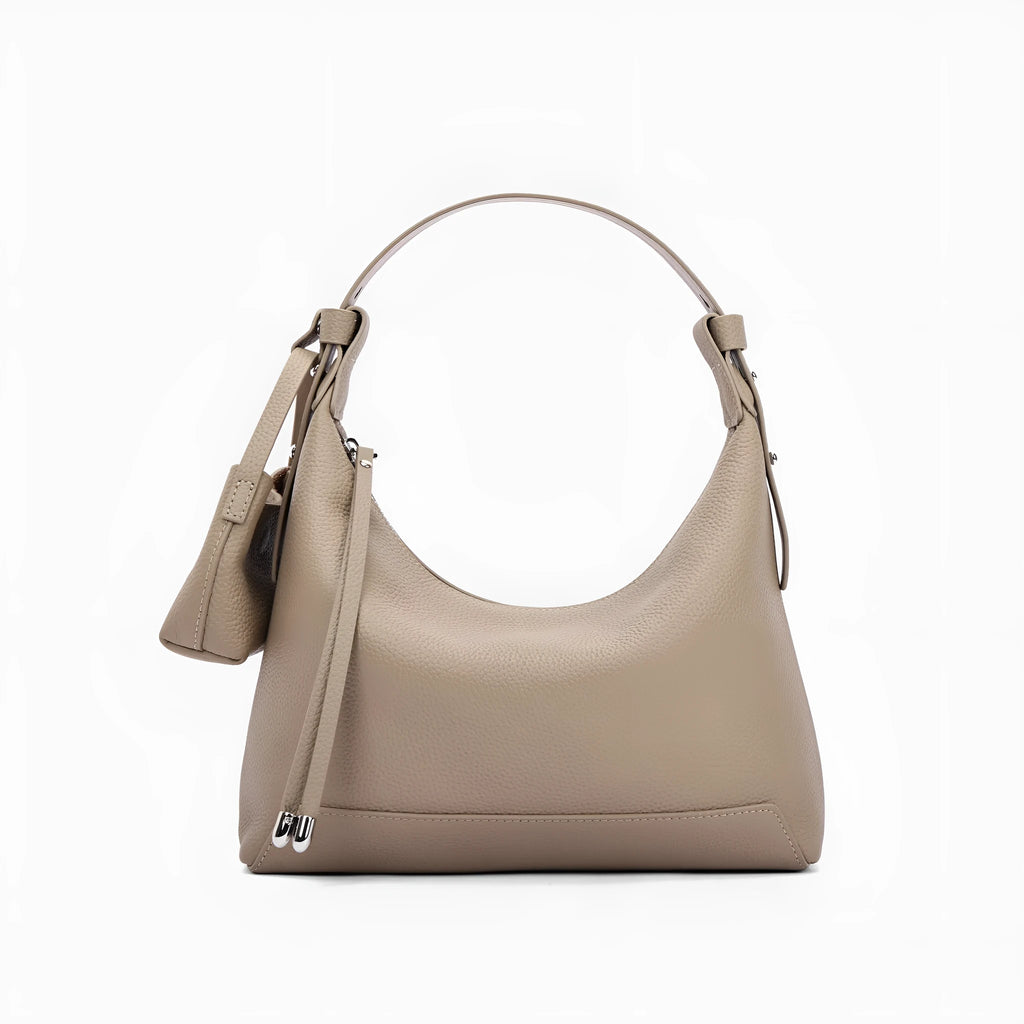 Simple black cowhide leather ladies shoulder bag with visible stitching and urban style design