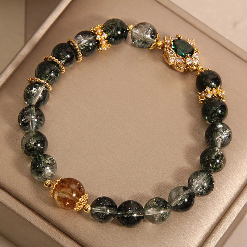 Gold rutilated quartz women's bracelet with green phantom quartz, ruby quartz beads and crystal accents