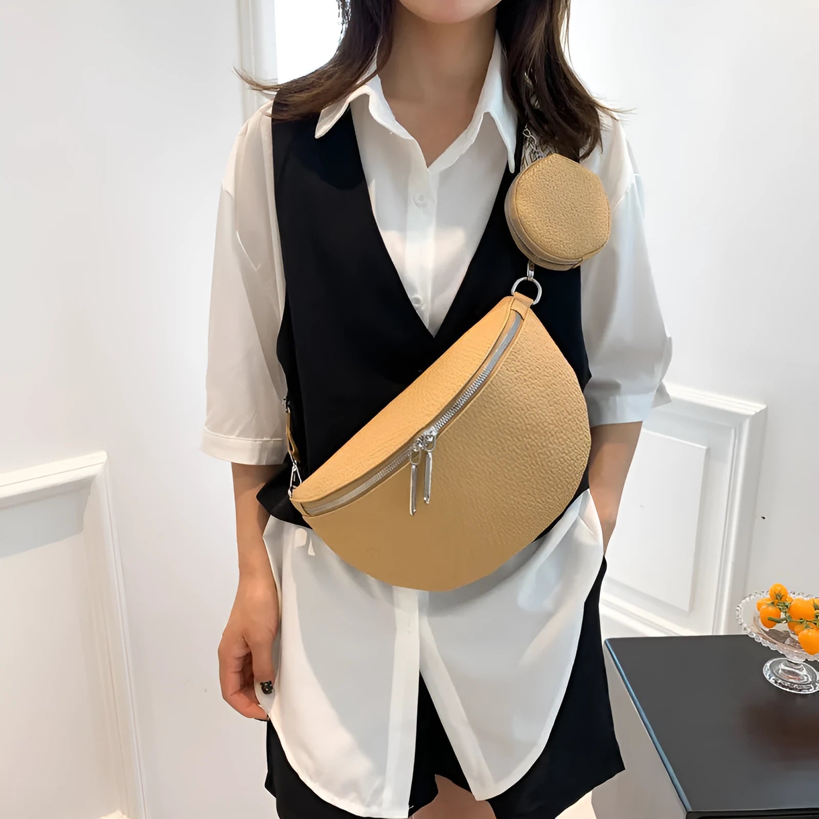 Women's solid colour textured PU crossbody bag with saddle lock hardware and clamshell opening