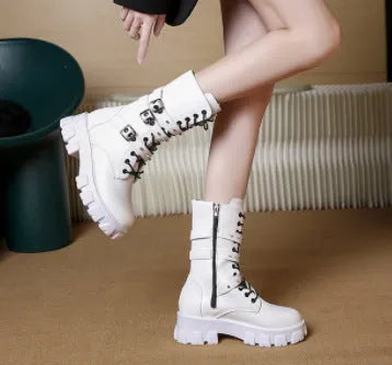 Women's black mid-calf boots with round toe, side zip, and adjustable metal buckle strap.