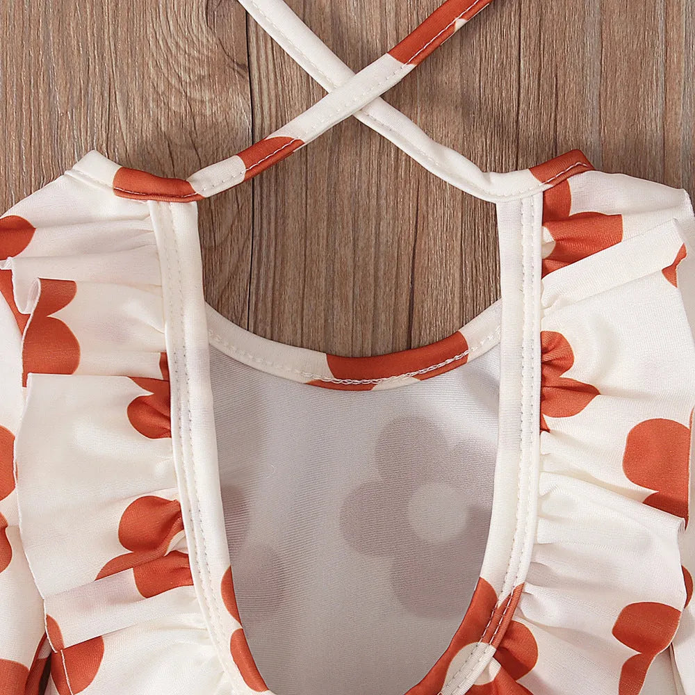 Girl's floral pattern open back swimsuit in orange red, available in sizes 70 to 110 yards.