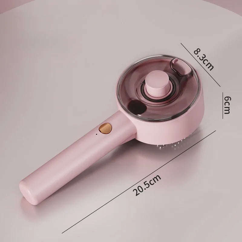 Pink and white cat steam grooming brush with mist spray function and stainless steel comb.