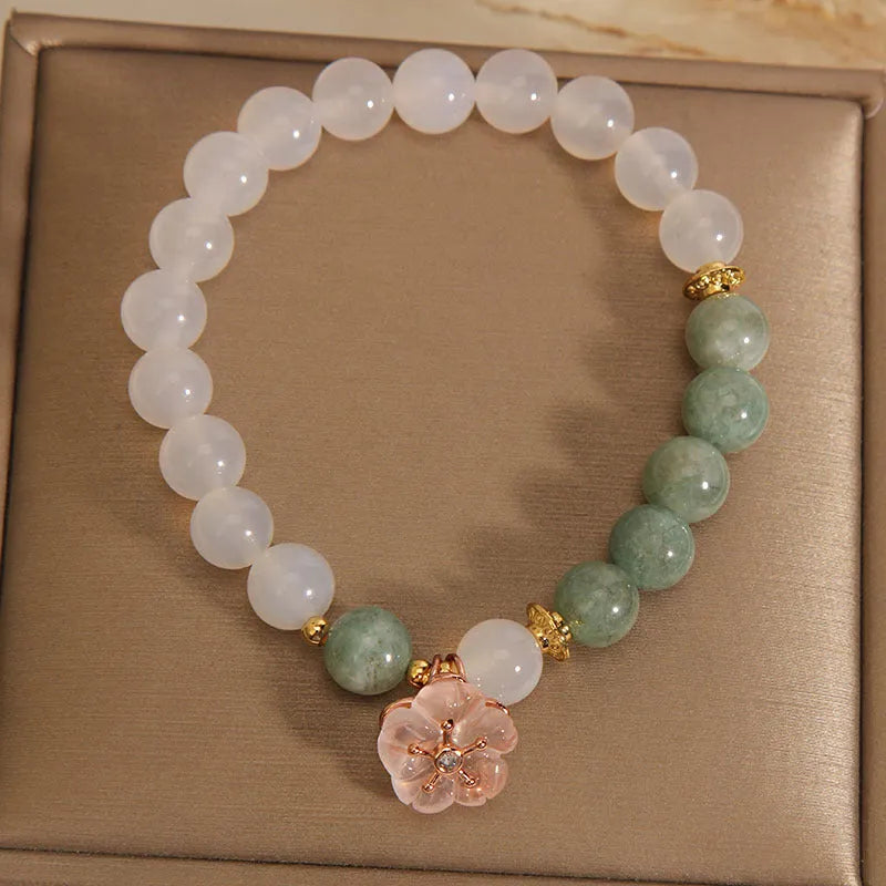 White agate and jade flower bracelet with pink accents on adjustable band
