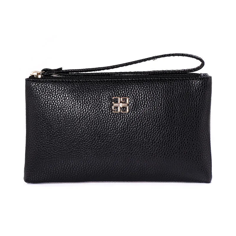 Woman holding a wine red zip-around PU leather phone wallet handbag with a 55-inch long strap.