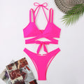 Women's solid colour strap bikini swimsuit in black, shown on a mannequin.