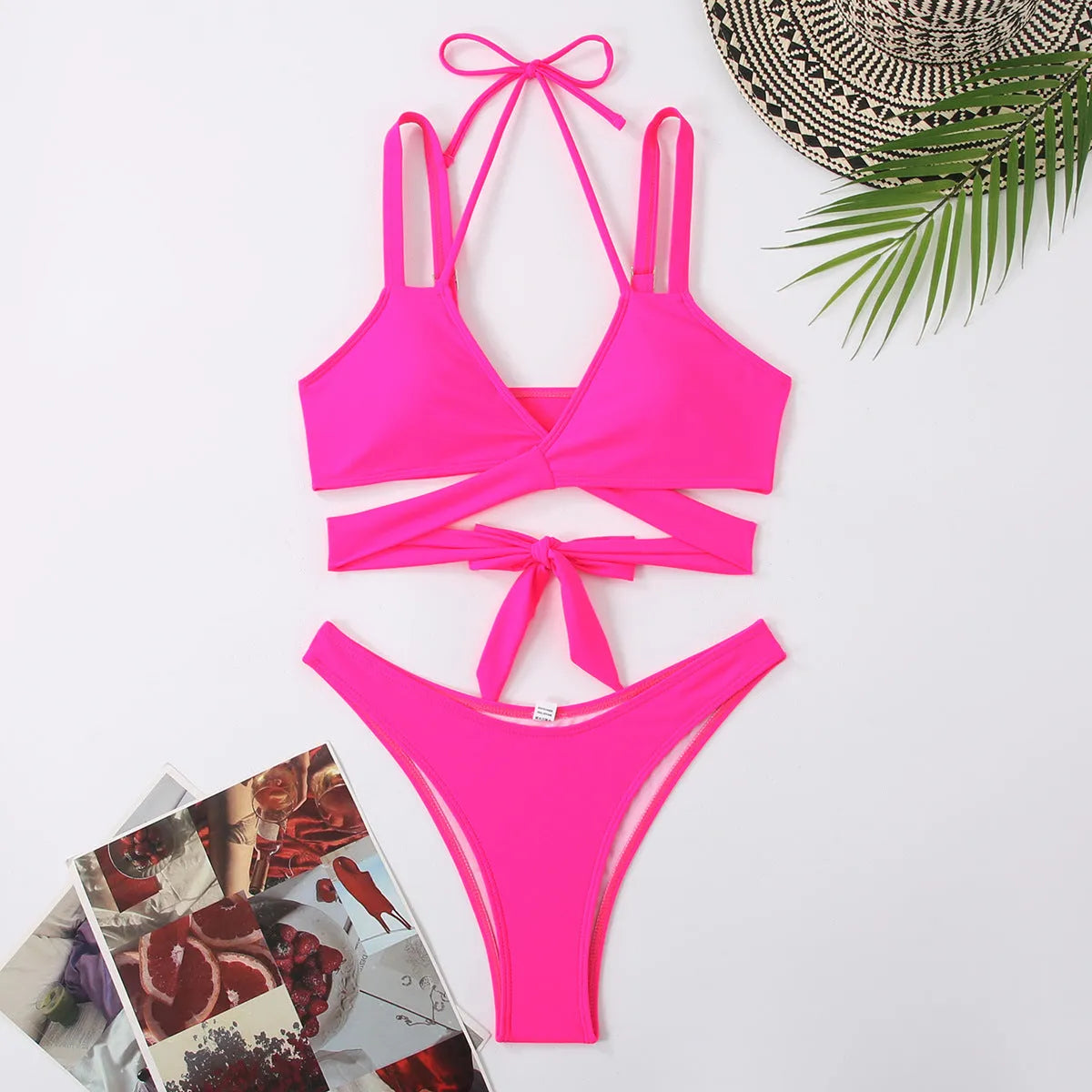 Women's solid colour strap bikini swimsuit in black, shown on a mannequin.