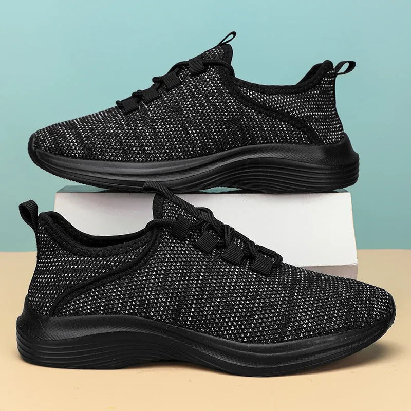 Women's low-top casual sneaker in grey with breathable mesh upper and lace-up front.
