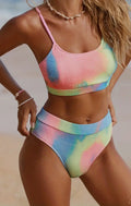 Women's orange and blue tie-dye pleated bikini on a white background