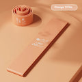 Four elastic resistance bands in green, beige, orange, and pink colours representing 30, 20, 15, and 10 lbs resistance levels