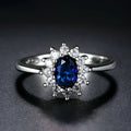 Blue moissanite copper flower ring with electroplated finish shown on finger