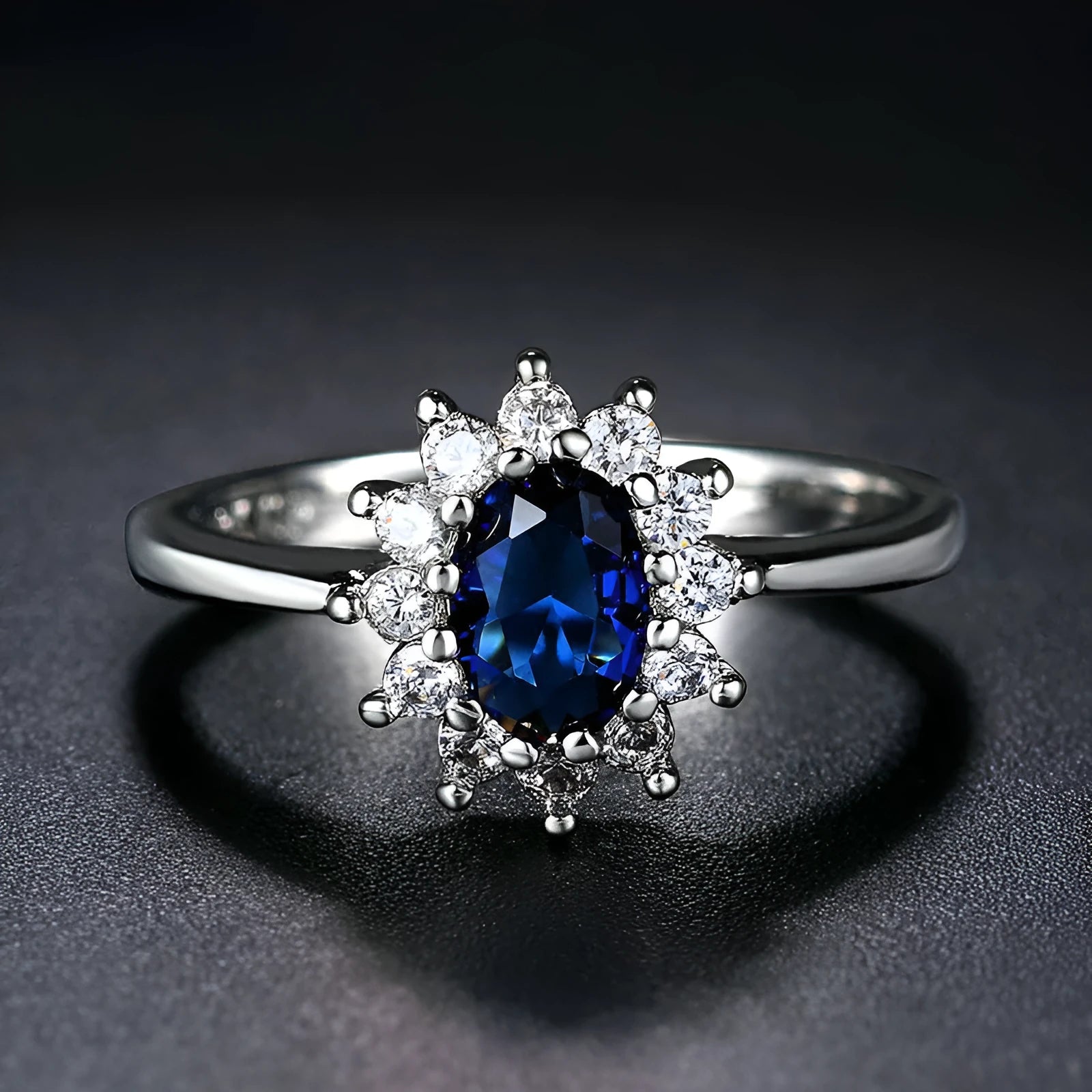 Blue moissanite copper flower ring with electroplated finish shown on finger