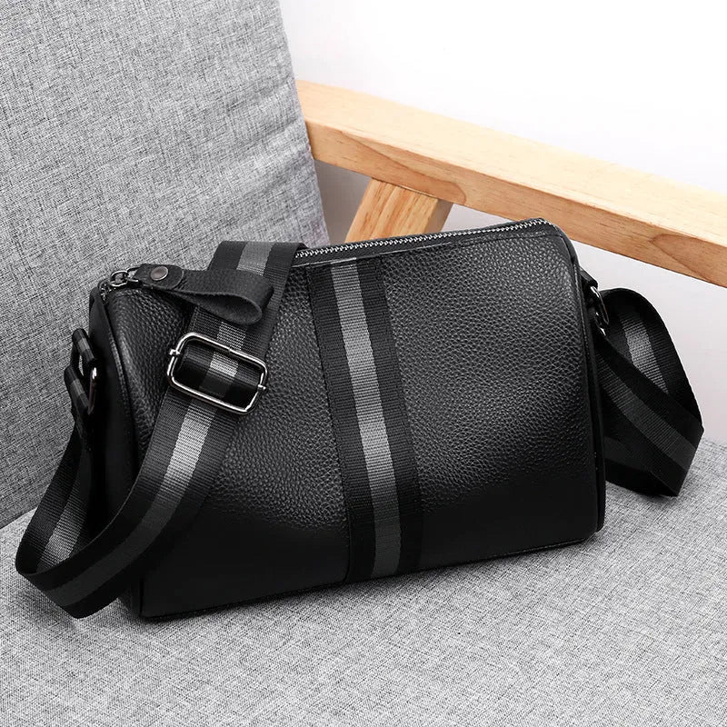 Black genuine leather one-shoulder crossbody bag with a large capacity.