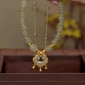 Green women's safety lock pendant bracelet with double-layer Xiangyun design and electroplated finish