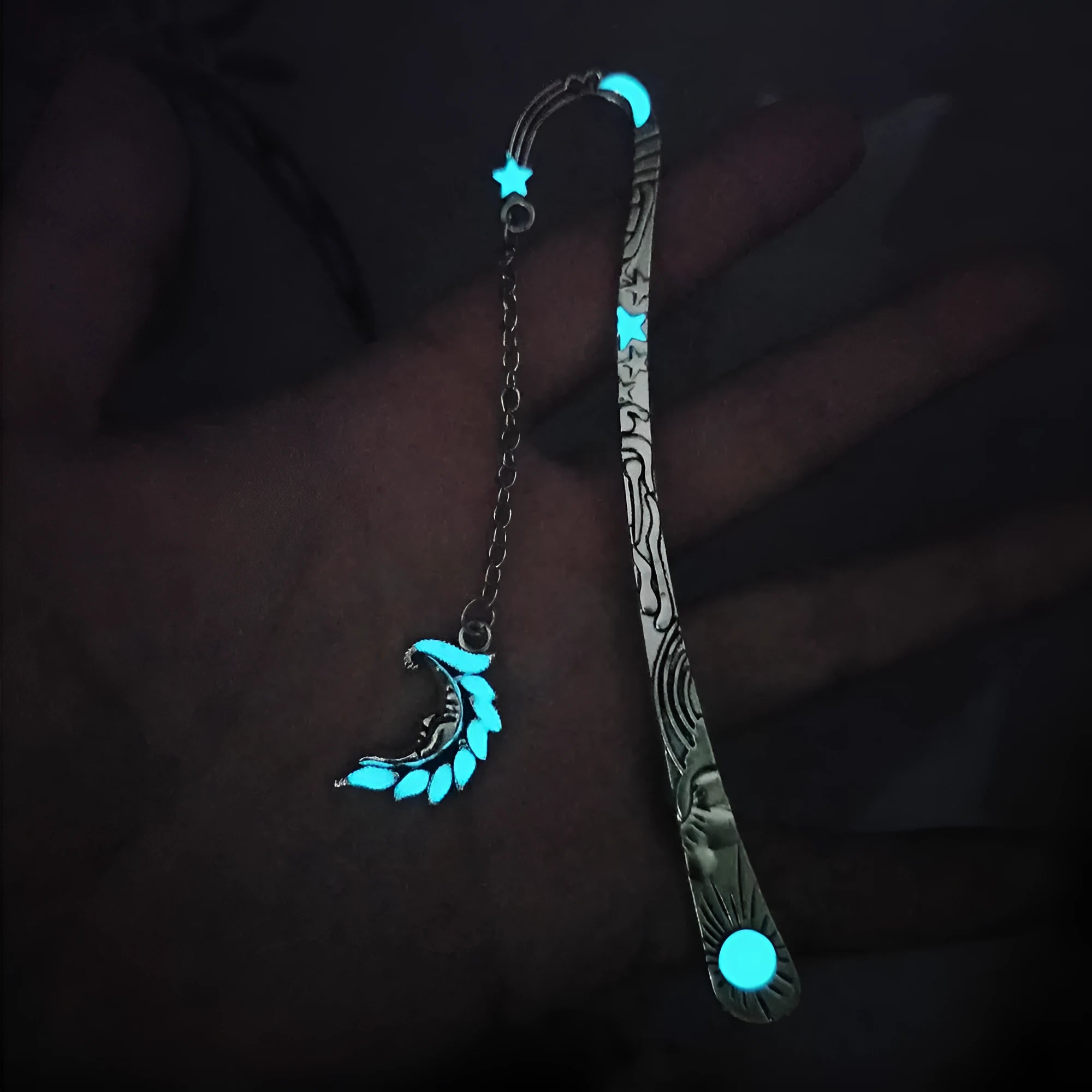 Retro five-pointed star metal bookmark glowing with celestial sun moon stars design