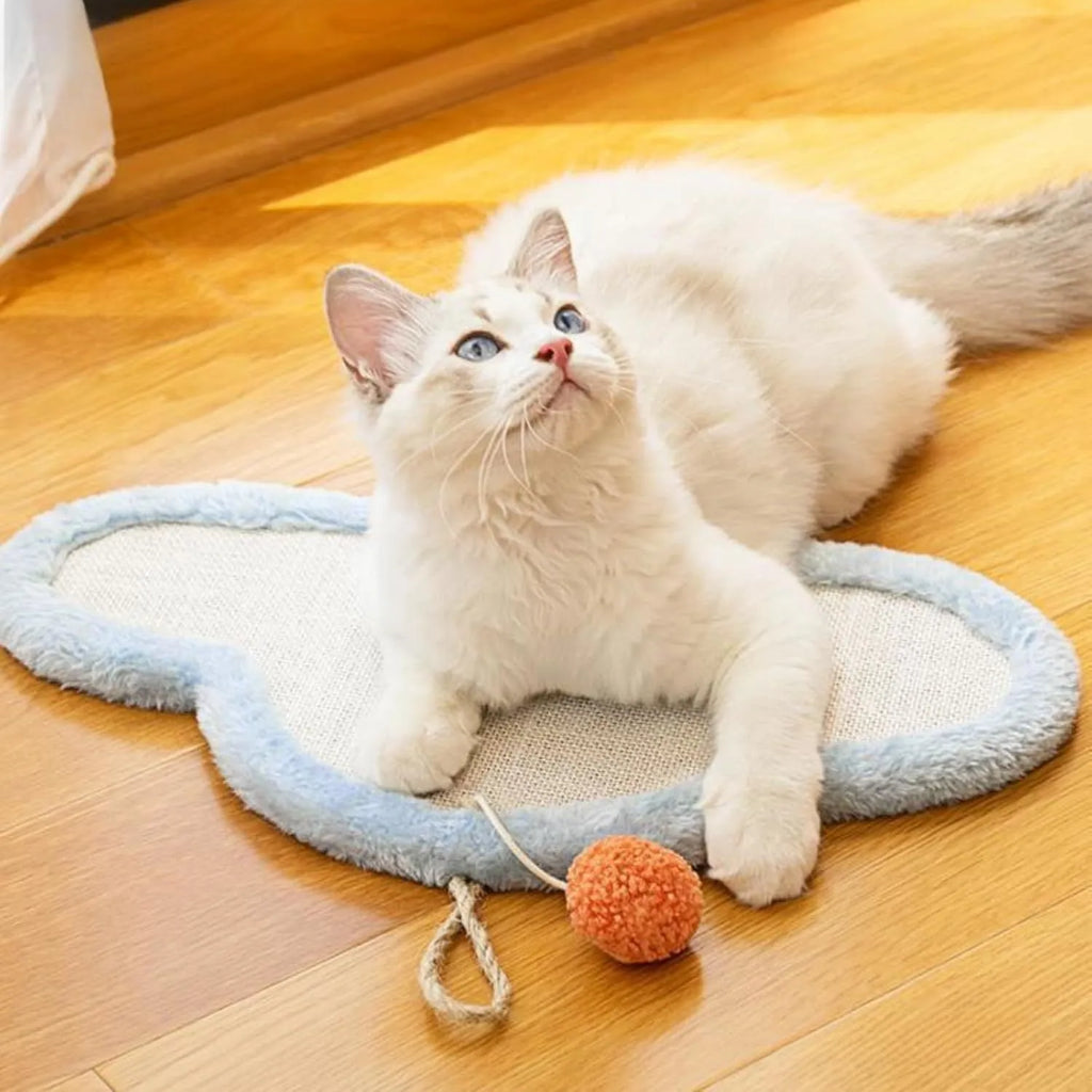 White wall mounted cat scratching mat with sleeping cat cartoon design on natural sisal.